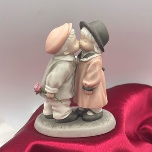 Enesco Figurine  "Love Sealed With a Kiss"; designed by Kim Anderson in 1997.